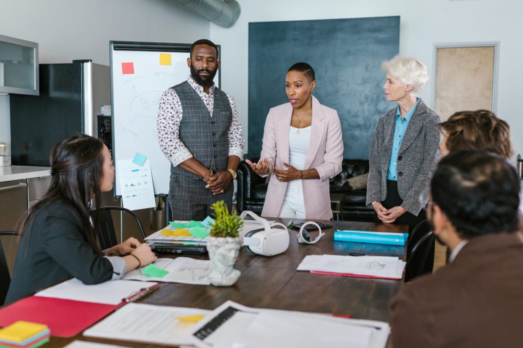 a group of people in a meeting