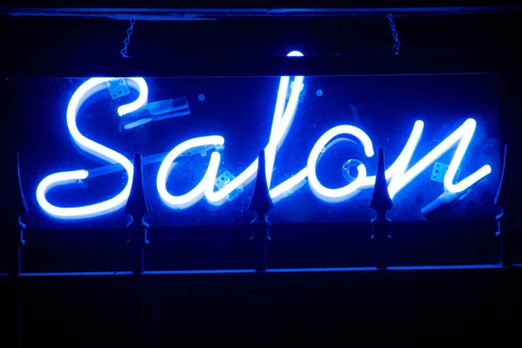 a neon sign with text