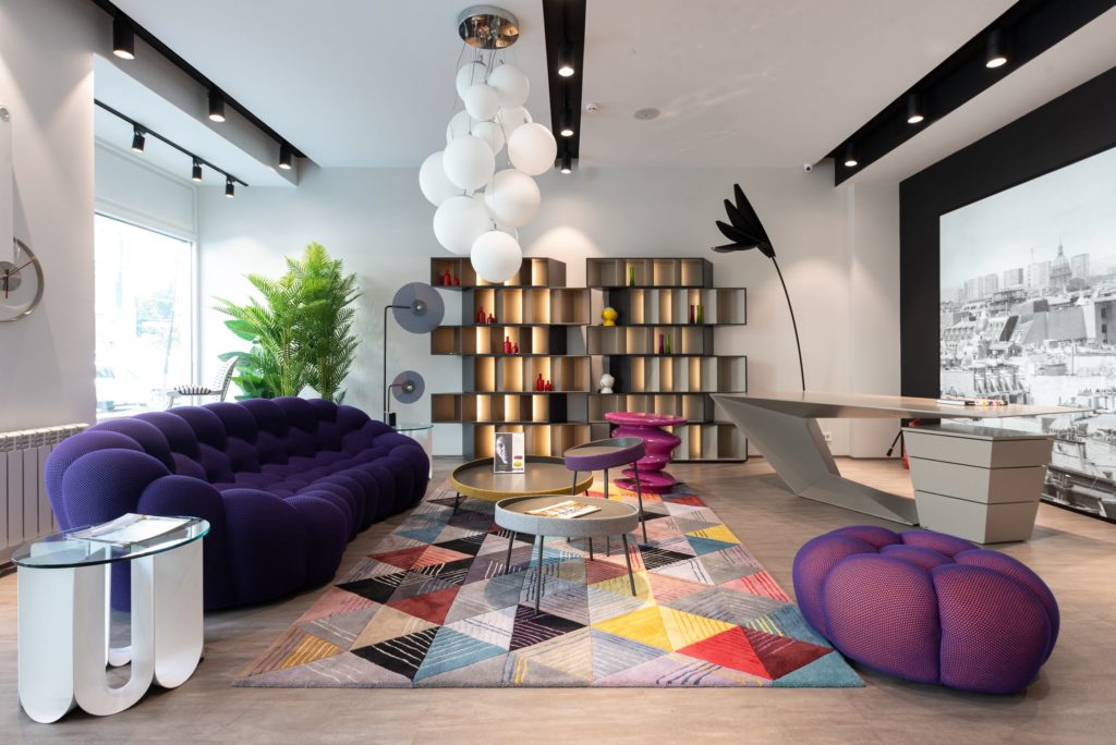 a living room with a purple couch