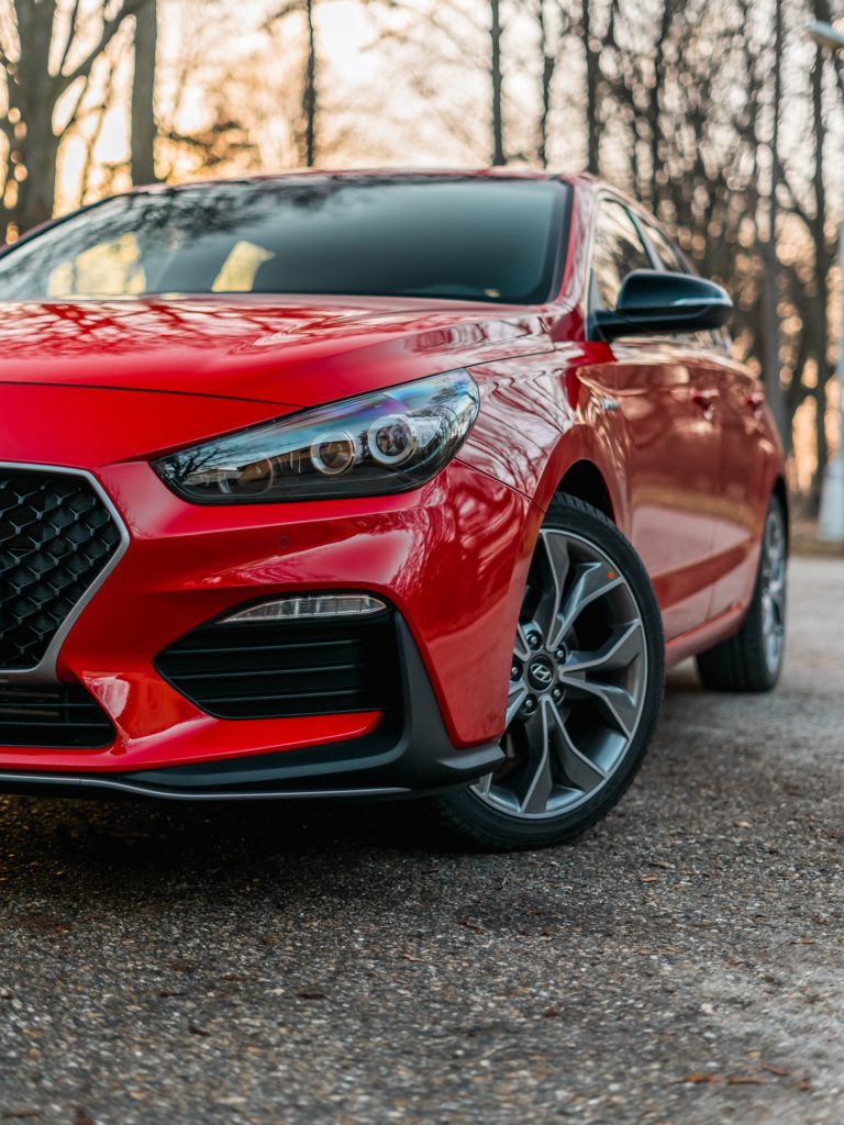 a red car parked on a road
