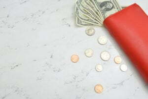 a red and white eraser on a white surface