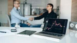 a man and a woman talking in a meeting room