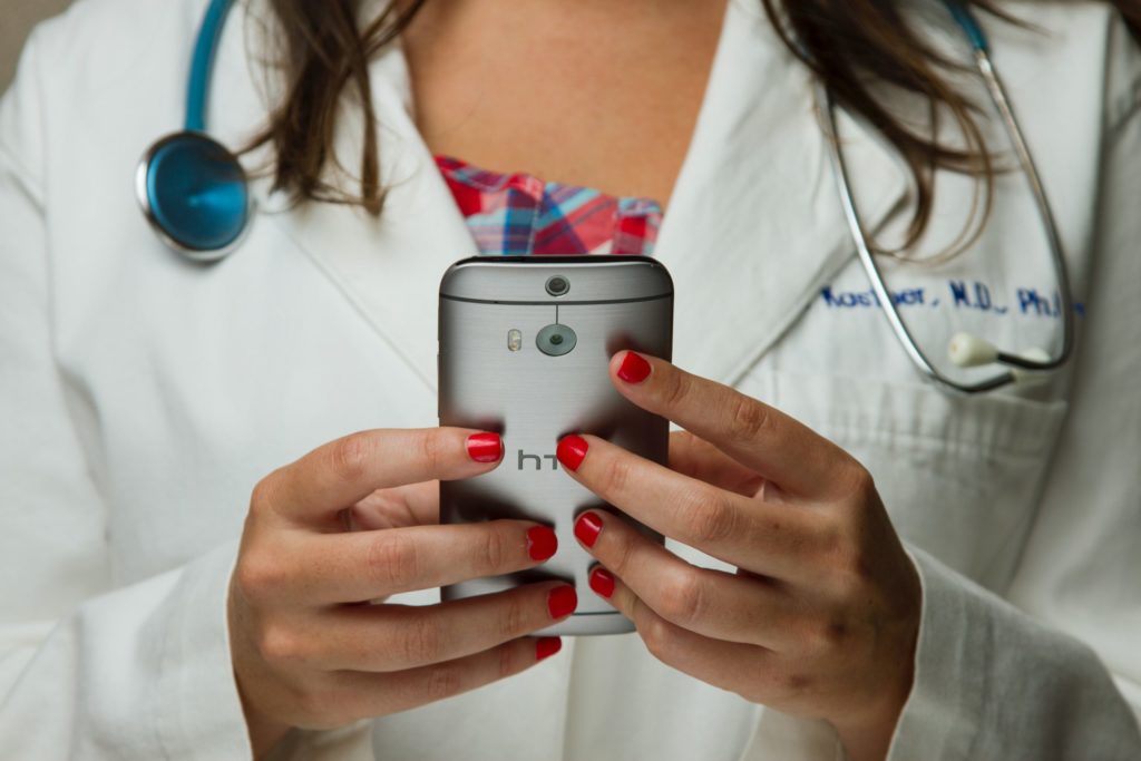 a doctor using a cell phone