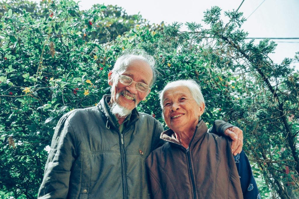 a couple of men smiling