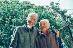 a couple of men smiling