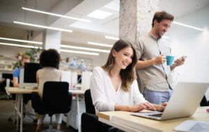 a man and a woman talking in an office