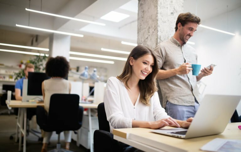 a man and a woman talking in an office