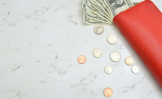 a red and white eraser on a white surface