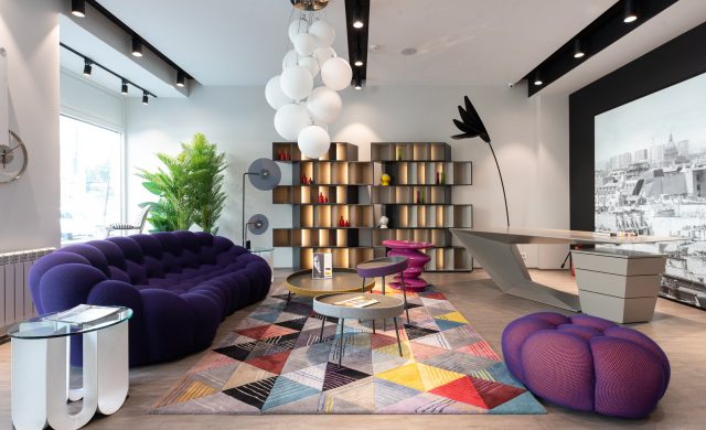 a living room with a purple couch