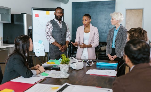 a group of people in a meeting