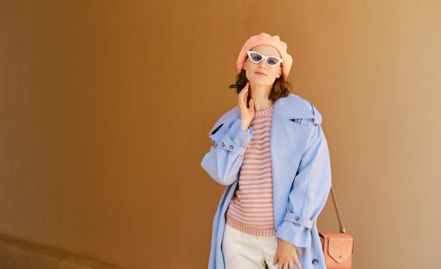 Cheerful positive woman in stylish colorful outfit posing outdoor