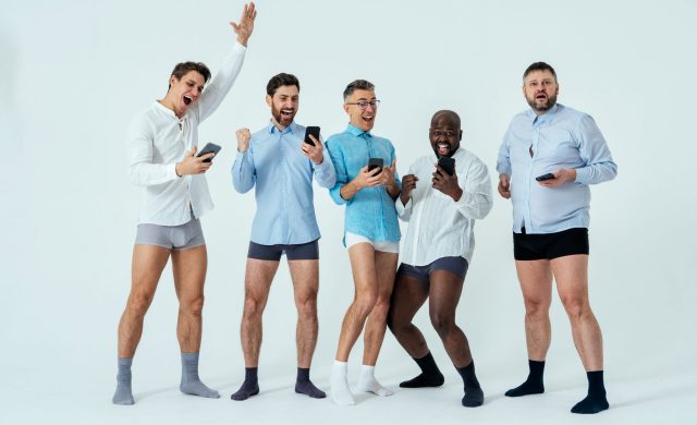 multiethnic men posing for a male edition body positive beauty set.  guys with different age, and body wearing boxers underwear and shirt