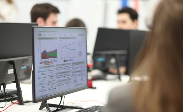 a person looking at a computer screen