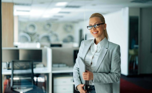 Portrait of a cheerful business executive.